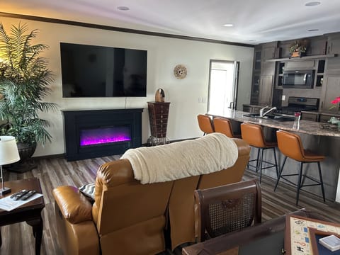 Cozy up in front of the fireplace or enjoy some TV