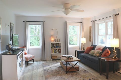 Relax after a day exploring in the airy living room, complete with Smart TV/Roku