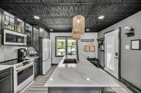 The kitchen features brand-new appliances for effortless cooking.