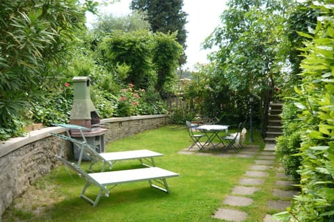 Furniture, Green, Outdoor Furniture, Shrub, Garden, Chair, Outdoor Table, Groundcover, Shade