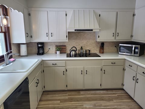 KITCHEN:  The home has a large and modern kitchen with all appliances including a dishwasher.  There is also a good supply of cooking and dining utensils.