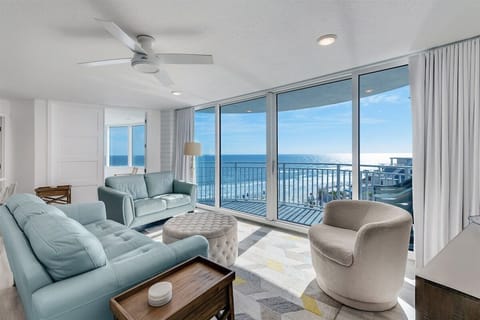 Bright and airy living room with floor to ceiling windows
