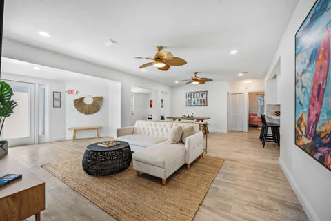Open living area with coastal-inspired decor and natural light