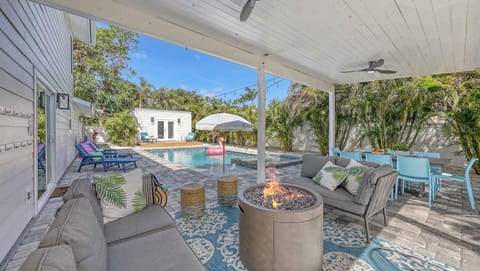 Lounge poolside under swaying palms, sip cocktails by the fire pit, and enjoy al fresco BBQ dinners beneath glowing string lights—your private slice of Florida paradise.