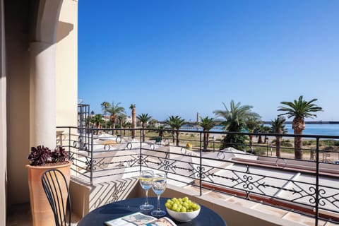 There is a balcony with a table and chairs where you can enjoy the view.