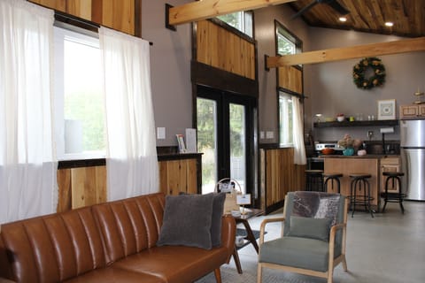 Living room with view into kitchen area.