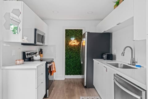 Whip up your favorite meals in this charming  kitchen, designed with modern touches.