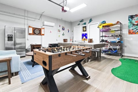 Game room with foosball, darts, and plenty of space to play.
