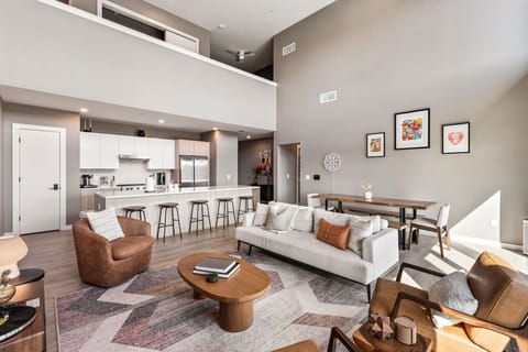 Bright and spacious living room off the kitchen. Smart TV, remote controlled room darkening shades, and pull-out sleeper sofa for ultimate comfort. Dining table that can seat 8 people.