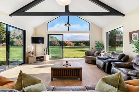 Spacious entertainment lounge, with 360 degree views of the surrounding mountains. Open flow dining area, kitchen and private patio area with private seating, children's play areas and BBQ.