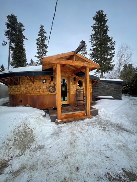 Snowy entrance way, with front door facing the road, in the loop driveway.