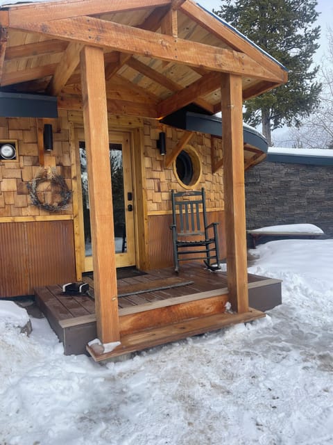 Front porch rocking chair is waiting for you.