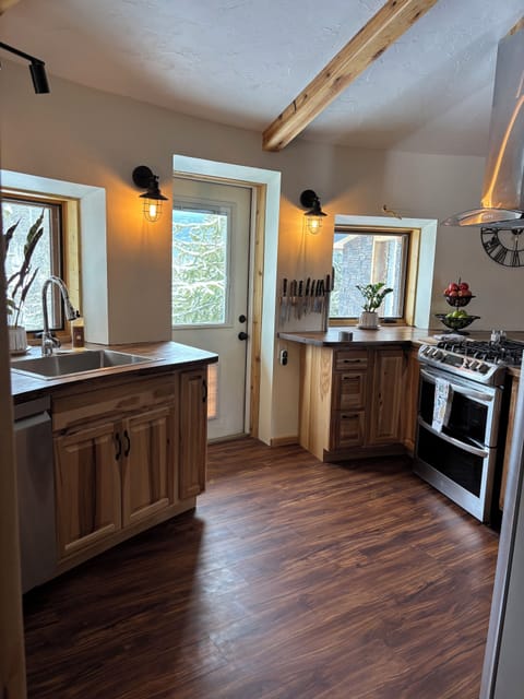 Fully loaded kitchen looks out toward the terrace & the river. A baker's heaven!