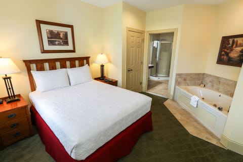 Cozy bedroom retreat with an in-room Jacuzzi, creating the perfect space for relaxation and comfort.