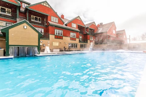 Steam rises from the warm water, creating a cozy escape after a day of adventure on the slopes.