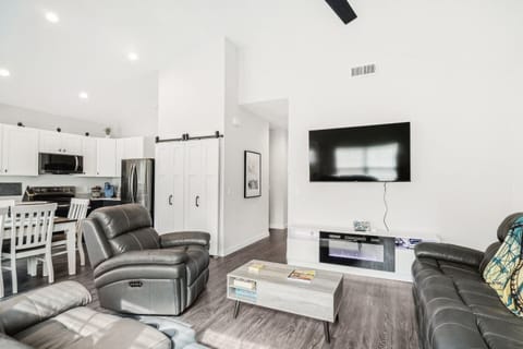 Lots of space in living room, kitchen, dining table, and pantry