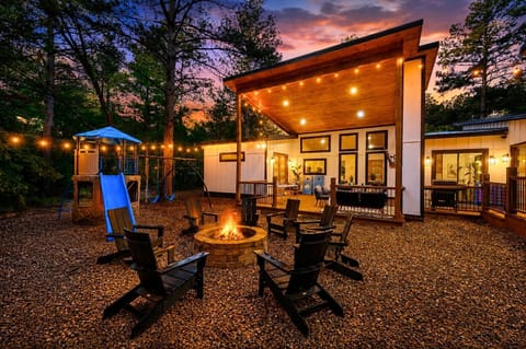 Amazing outdoor space with a playset, firepit area and hot tub