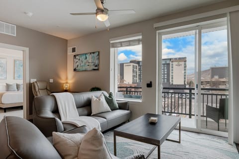 Luxury Leather Couch with original local art. 65` Roku TV.  And downtown views with the mountain backdrop.