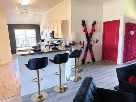 🍽️ Fully Equipped Kitchen for Your Stay 🍽️
Step into this modern and fully stocked kitchen, designed for both convenience and style. Featuring stainless steel appliances, including a stove, microwave, and refrigerator, along with ample counter space and sleek cabinetry. Enjoy a cozy breakfast nook with bar stools, perfect for sipping morning coffee or sharing a late-night sn...