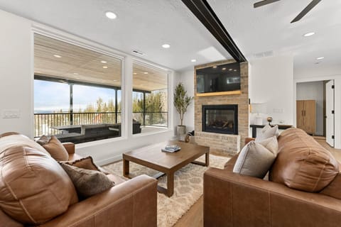 Living room with large windows & TV