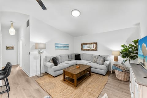 Cozy living room with a modern sectional sofa and natural light.