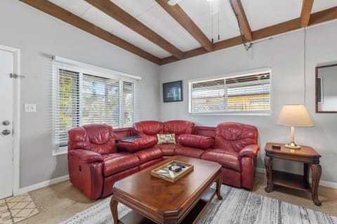 Large living room with plush comfy leather sofas perfect for family movie nights