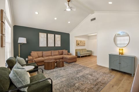 Soaring vaulted ceilings and a massive, plush sectional create the ultimate social hub for your group. Grab a drink and settle in.