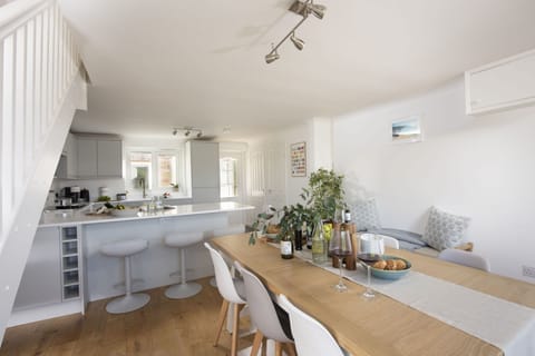 Poldreth, Porthtowan. Ground floor: Continue into the stylish kitchen and dining area, where preparing family meals and spending time with loved ones is effortless