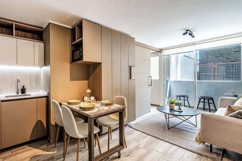 Cozy studio apartment with modern amenities and a bright, inviting living space perfect for relaxation.