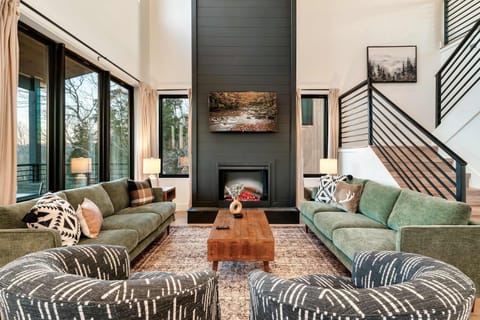 Sunlit space with stylish decor and a warm fireplace for relaxation and fun!