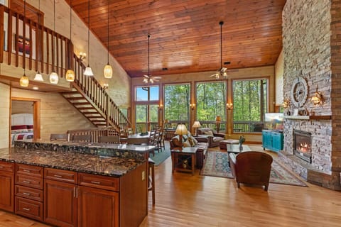 A chef’s kitchen opens directly to the living room, making it easy to cook, entertain, and stay connected with family and friends throughout your stay.