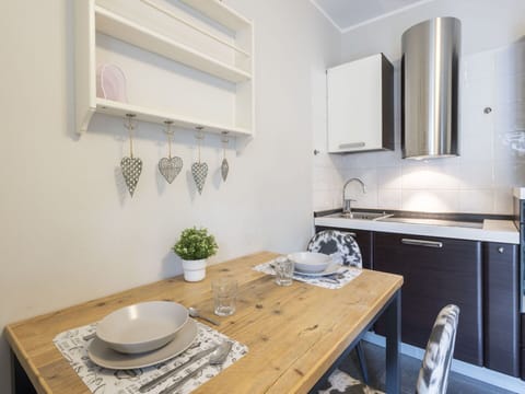 Furniture, Kitchen Appliance, Interior Design, Countertop, Kitchen, Major Appliance, Cabinetry, Flooring, Wood, Room