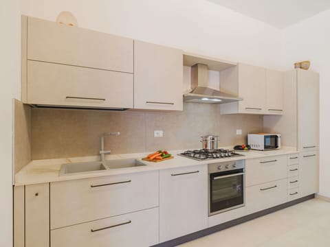 Kitchen, Countertop, Kitchen Appliance, Major Appliance, Cabinetry, Wood, Flooring, Stove, Kitchen Sink, Kitchen Stove