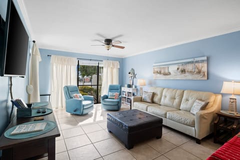 Relax in this bright living room with coastal-inspired decor and comfortable seating.