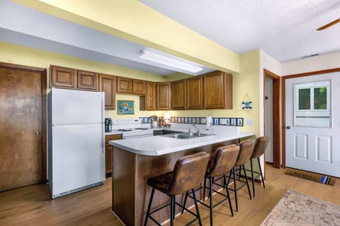 Sip morning coffee or grab a bite at the kitchen counter, seating 4