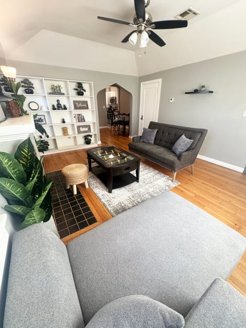 Relax in the living room with Chaise lounge and 50" Smart TV.
