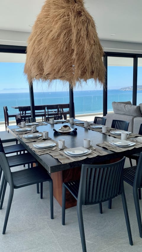 This bright and airy living room opens directly to this spectacular ocean view