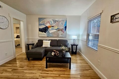 See the living room—perfect for relaxation and family bonding, complete with a cozy setup and a smart TV for entertainment.