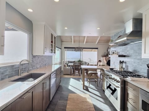 Step into this stunning beach house kitchen, completely remodeled in 2026 with chef-grade appliances, granite countertops, and custom cabinetry. Bright, functional, and fully stocked for your stay!