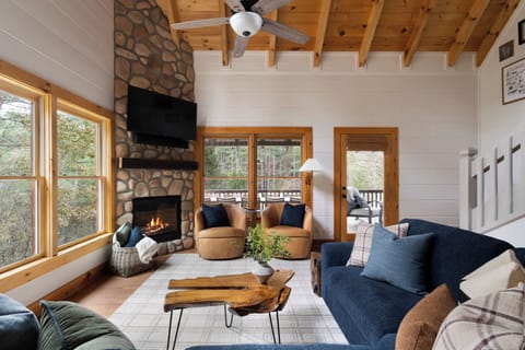 Luxurious living room is a great place to gather with a fireplace