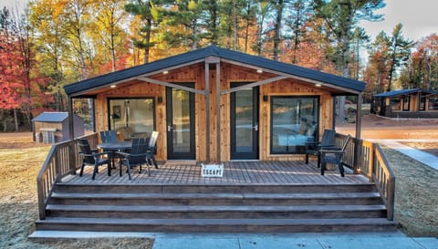 Arrive to a cozy cabin retreat framed by autumn color.