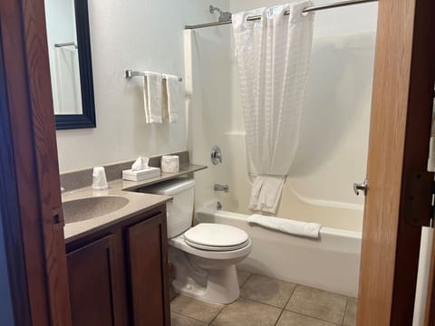 Step into a bright bath with fresh towels and deep soak.