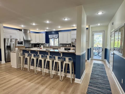 well appointed kitchen with seating at the bar/island