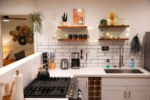 KITCHEN with Fully stocked with cookware and utensils ,12-cup drip coffee maker