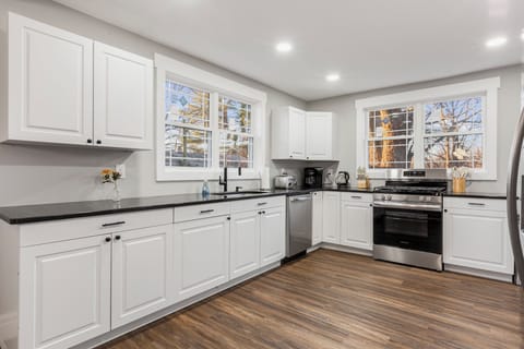 Outfitted with sleek stainless steel appliances and elegant granite countertops, our kitchen is perfect for whipping up and enjoying meals with your favorite people!  Brew your morning cup with the convenient coffee maker and enjoy the fully stocked essentials ready for your culinary adventures. The kitchen seamlessly flows into the dining and living areas, making it perfect fo...