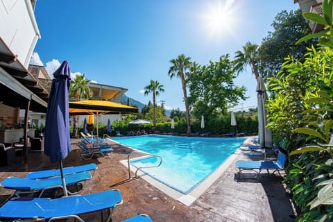 Seasonal outdoor pool, open 11:00 AM to 8:00 PM, pool umbrellas