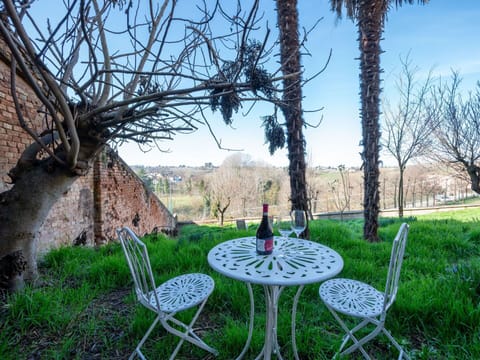 Furniture, Chair, Outdoor Furniture, Table, Outdoor Table, Umbrella, Flowerpot, Garden, Houseplant, Kitchen & Dining Room Table