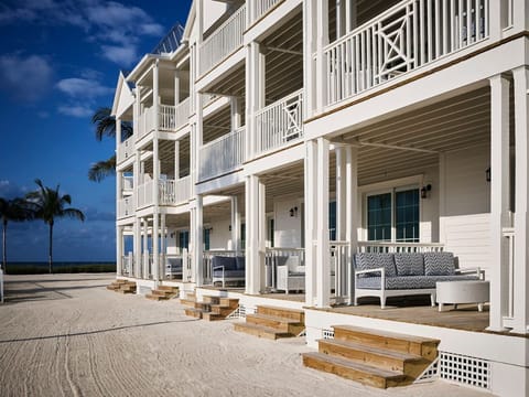 Elegant verandas lead to private retreats, blending coastal luxury with serene seaside views.