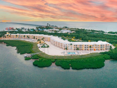Aerial views of this lush coastal escape highlight the perfect blend of luxury and natural beauty.