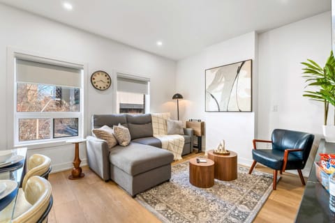 Bright and modern living area with a comfortable sofa and clean design.